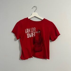A very worn Taylor swift red cropped tee.